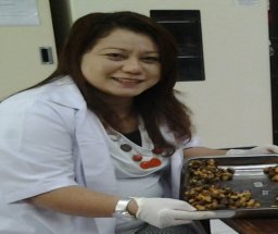 Dr. Rosmin Mariati Tinggenehe, S.Si., Apt.